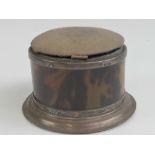 An HM silver and tortoiseshell inkwell later converted for use as a jewellery box, 9cm dia.