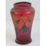 A small iridescent glass shoulder vase decorated with holly leaves throughout. 10cm high.