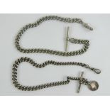 A HM silver graduated watch chain having T-bar and clasp with 1885 three pence coin upon, 33.4g.