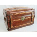 An unusual vintage steamer dome top travel trunk having brass studded wooden stays throughout,
