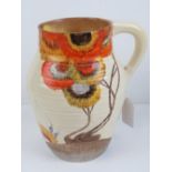 A Clarice Cliff Bizarre pattern handled jug, measuring 19.5cm high.