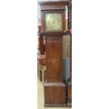 An eight day striking cottage long case clock having brass face,