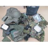 A quantity of assorted militaria including; machine gun covers, Bren spares wallet, US military bag,