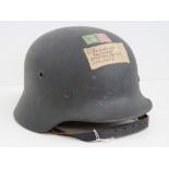 A WWII German Luftwaffe helmet having leather liner and chin strap,