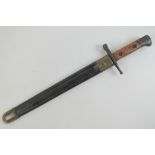 An Italian M91 Carcano model 1891 bayonet having 30cm blade, with leather and brass scabbard.