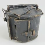 A WWII German MG34/ 42 ammo drum magazine, Afrika Korp tan paint, over painted in Luftwaffe blue.