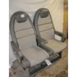 A pair of Concorde passenger seats made by Britax in grey upholstery with leather trim and folding