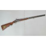 An antique Percussion 12 bore shotgun. Will cock and trigger. No licence required.