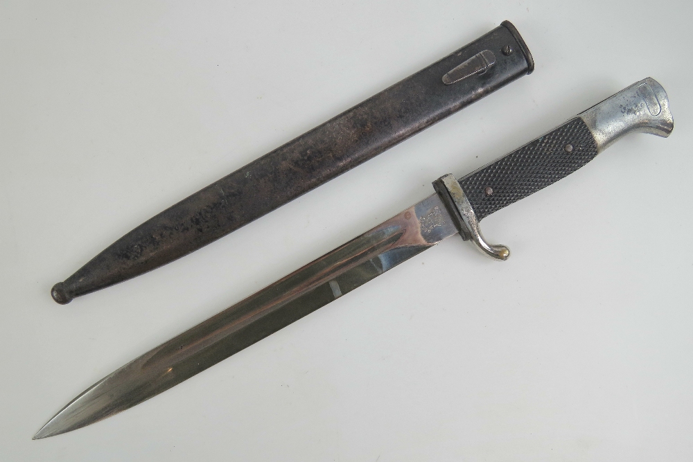 A WWII German K98 Parade bayonet, blade marked for Alcoso Solingen and measuring 25cm in length,