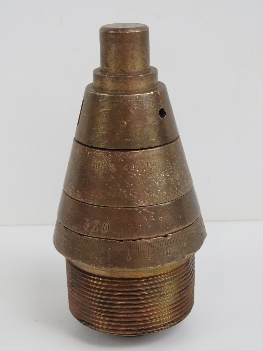 A British WWII 3" brass shell case fuse head.