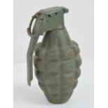 An inert US Vietnam war pineapple grenade.