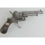 An antique British Pinfire 7mm calibre revolver with engraved receiver, cocks and trigger (a/f).