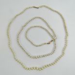 Two faux pearl necklaces each with 9ct g