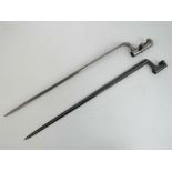 Two socket bayonets, one having cruciform blade and numbered 13265.