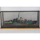 A scale model of HMS Bluebell including figures, rigging, lifeboats, etc, in perspex case on plinth,