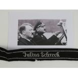 A rare SS Officer's cuff band 'Julius Schreck' cut from black SS parade uniform.