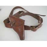 A WWII Webley MK4 .455 Cal brown leather holster with belt and strap.