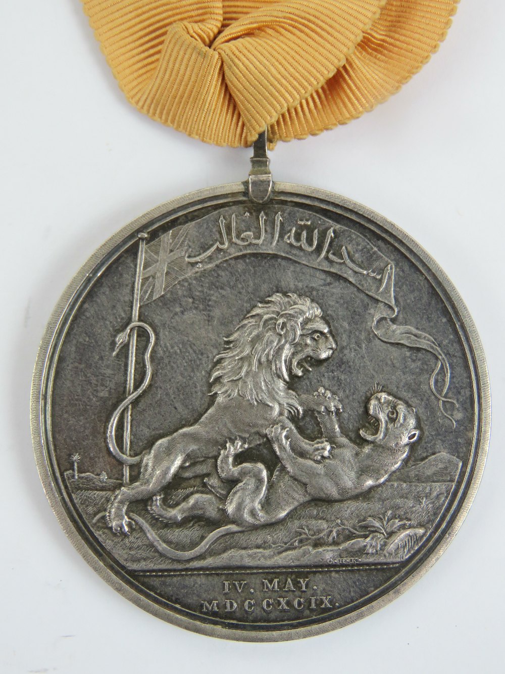 An Honourable East India Company medal for Seringapatam 1799, with ribbon, silver, 48mm, Soho Mint.