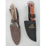 A Joker stainless steel knife in leather sheath together with a Gurba knife in canvas sheath.