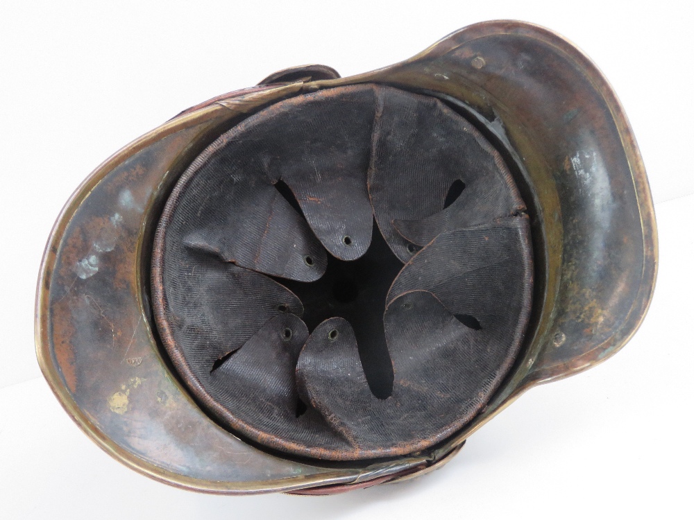 A French 19th century fireman's helmet in brass having red plume upon. - Image 4 of 6