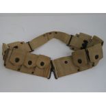 A WWII US M1 Garand ammo bandolier which can hold nine clips.