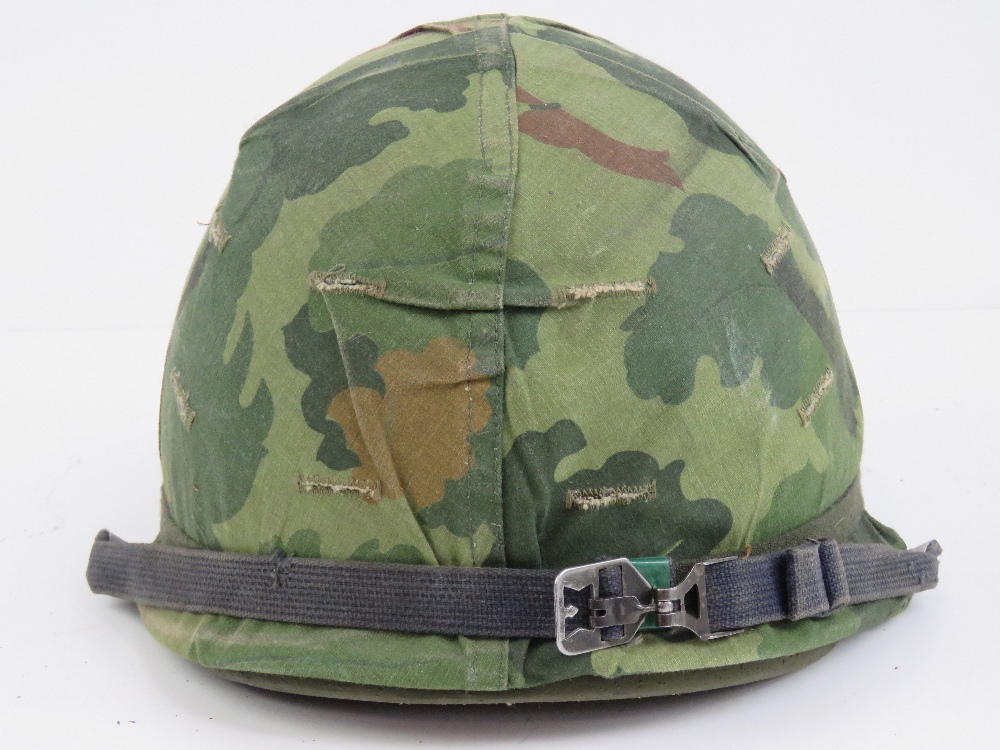 A US Vietnam war helmet with liner and helmet cover. - Image 2 of 6