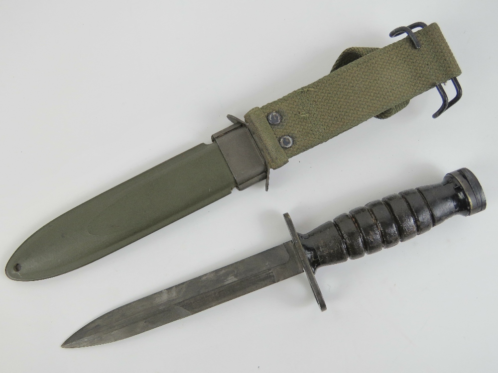 A WWII US M1 Carbine bayonet with scabbard and canvas frog. - Image 2 of 4