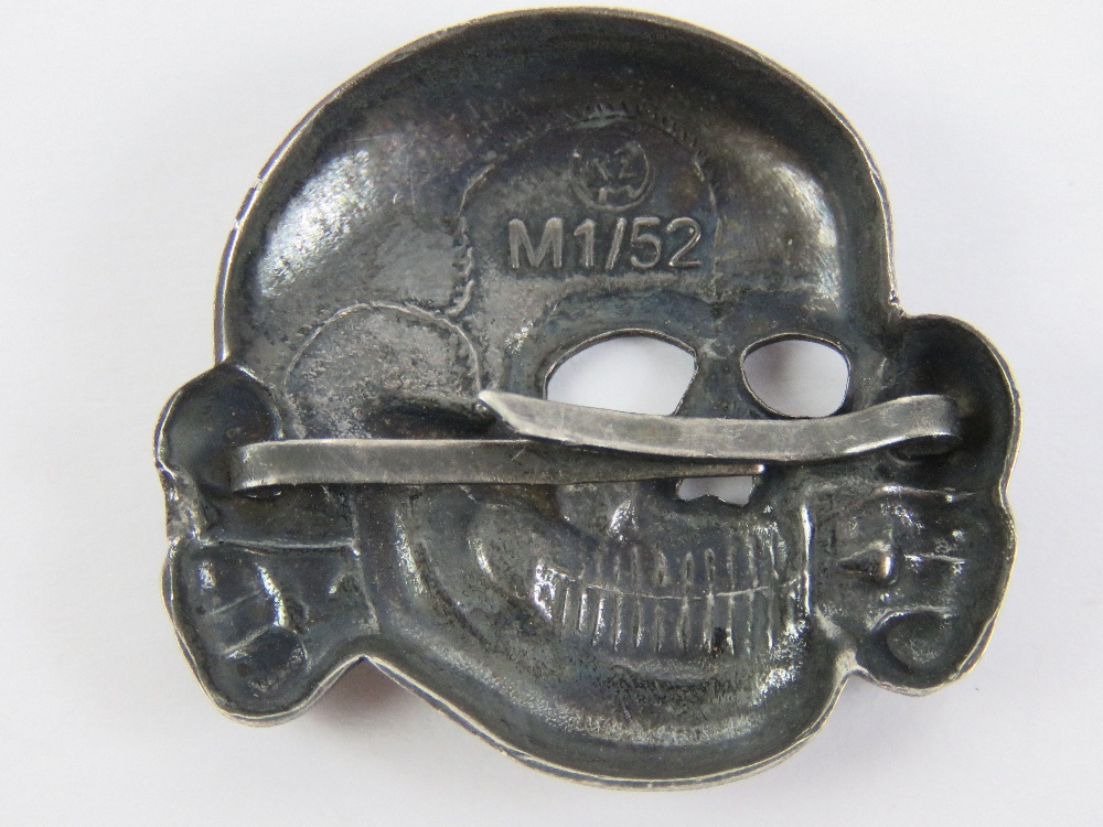 A WWII German SS skull badge for peaked cap, having RZN M1/52 makers mark. - Image 2 of 3