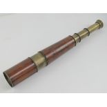 A four draw military brass and leather covered telescope made by R & J Beck Ltd London, dated 1917,