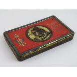 A 1900 Boer War South Africa chocolate tin containing remnants of original chocolate.