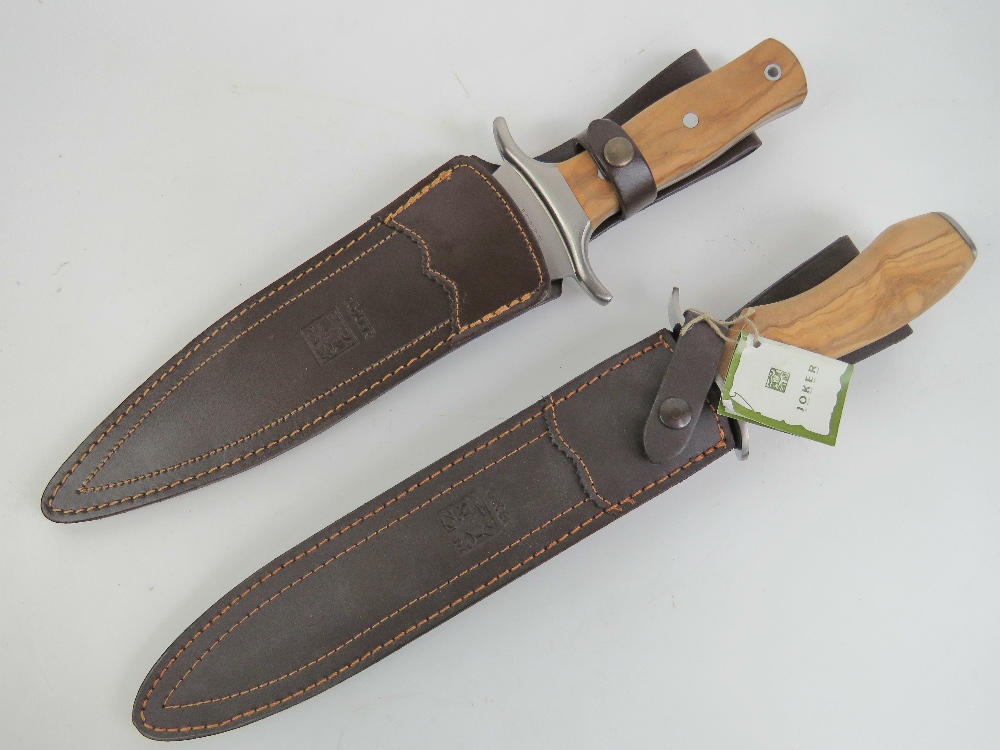 Two Joker knives, each having leather sheath.