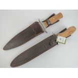 Two Joker knives, each having leather sheath.