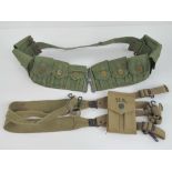 A WWII US M1 Garand ammo bandolier for ten clips together with a colt 1911 magazine pouch dated