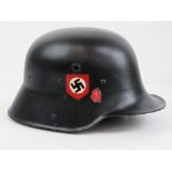 A WWI German helmet over painted and having replacement liner and chin strap.