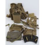 A WWII British webbing set, pouches, water bottle, shoulder straps, a Bren gunners kit, two wallets,