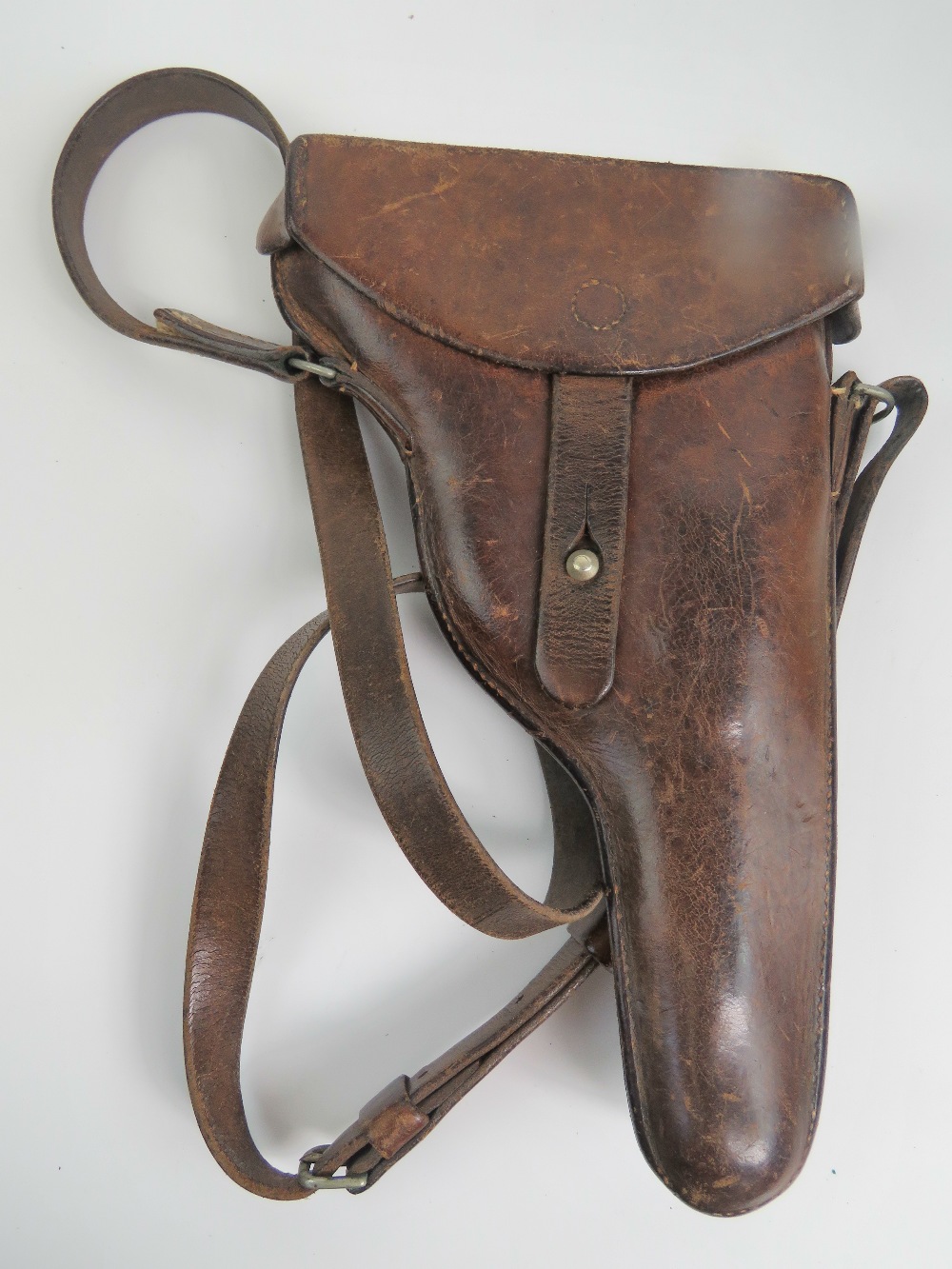 A Swiss 1882 revolver holster in brown leather with strap.