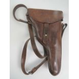 A Swiss 1882 revolver holster in brown leather with strap.