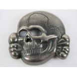 A WWII German SS skull badge for peaked cap, having RZN M1/52 makers mark.