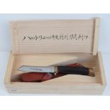 A boxed Hattoni 2005 limited edition knife, 21/200, having leather sheath.