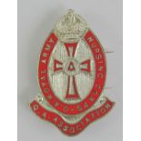A Queen Alexandra's Royal Army Nursing Corps Association badge inlaid with red enamel, made by J.R.