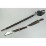 A sword with leather sheath, an Oriental dagger in wooden sheath and a Bowie knife. Three items.