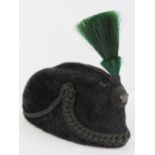 A British Victorian Rifle Brigade Officer's busby with green plume,