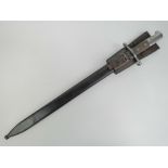 A Swiss M1914 Schmidt Rubin Sawback Pioneer bayonet with scabbard and leather frog.