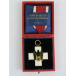 A WWII German Social Welfare medal in white and black enamel, in original box with ribbon,