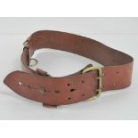 A Sam Browne leather belt having label upon for Peal & Co 487 Oxford St London W1, 94cm in length.