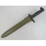 A WWII M1 Garand bayonet with scabbard dated 1943.