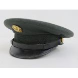 A US Vietnam War peaked cap with badge,