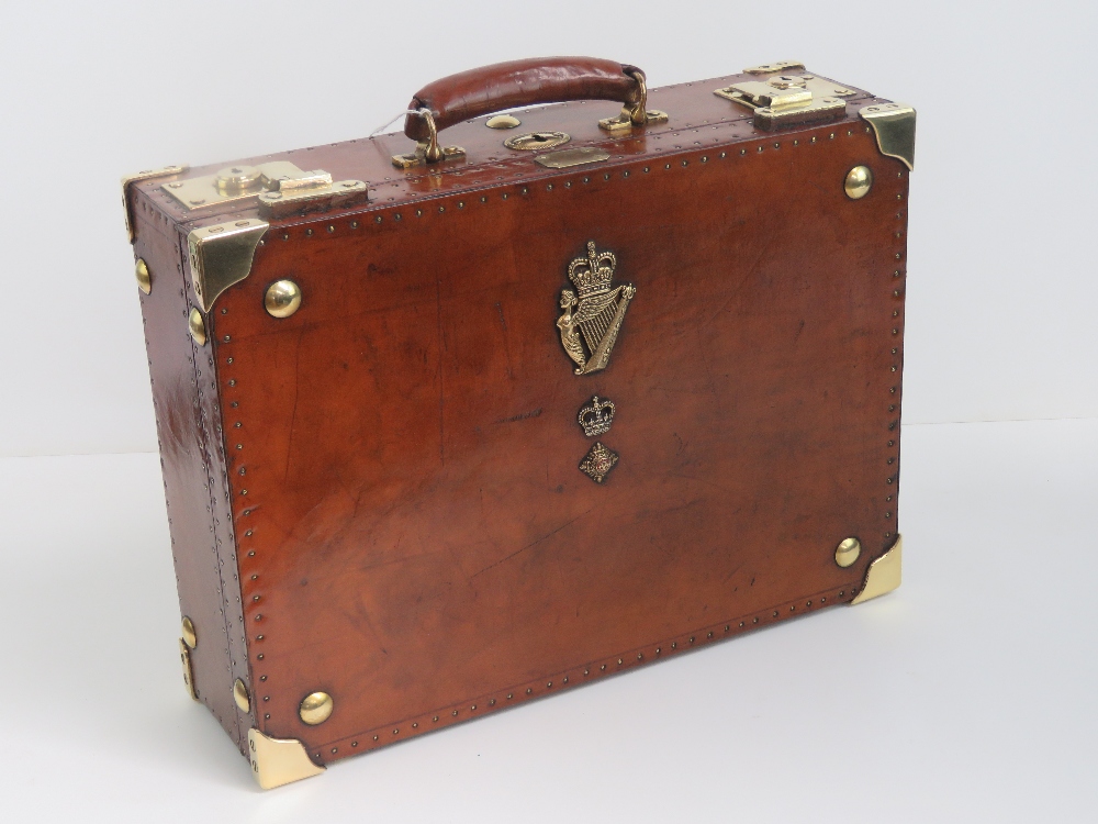 A fine leather covered dispatch box bearing insignia for the Ulster Defence Regiment and having