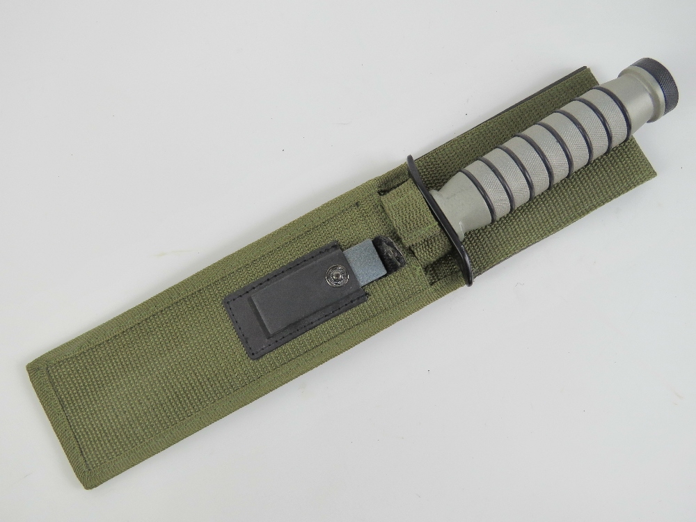 A Tomahawk survival knife with sawback b