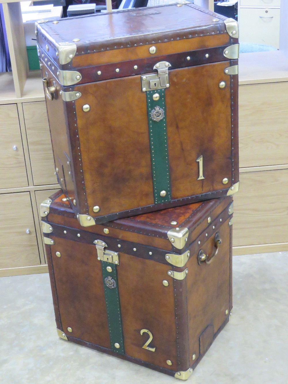 A fine pair of 'Army and Navy' style leather covered military trunks each bearing Royal Engineers